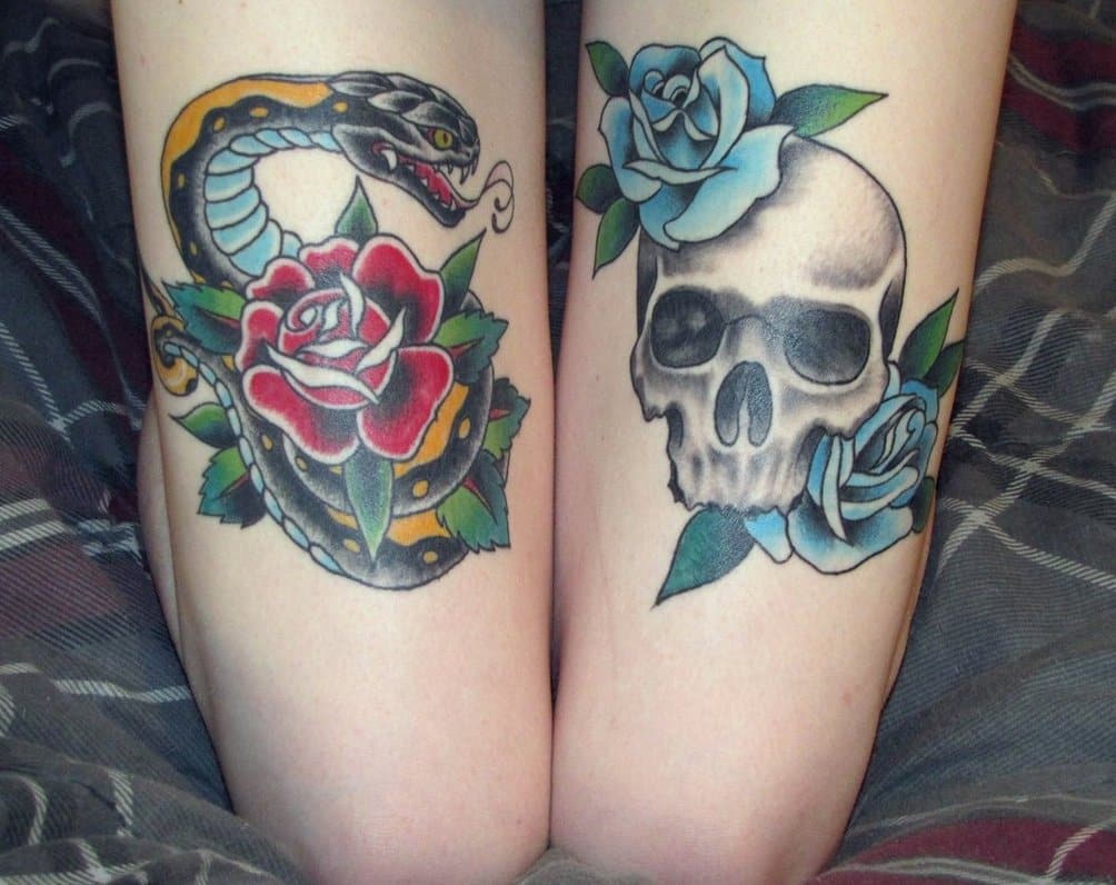 skull and snake thigh_tattoo