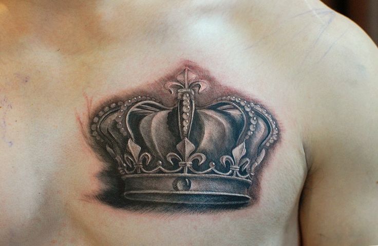 man-chest-grey-ink-crown-tattoo