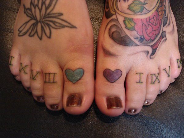 roman-numerals-tattoo-on-feet-for-women