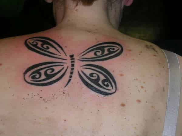 Tribal-Dragonfly-Tattoo-On-Upper-Back