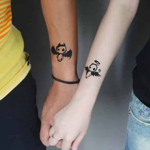 angel-devil-couple-arm-tattoos