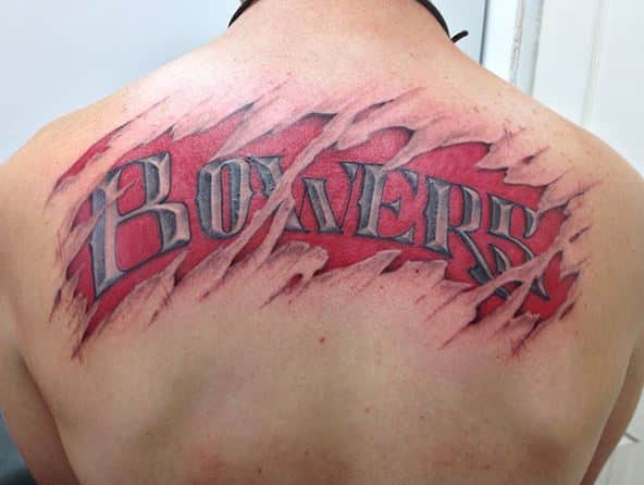 badass-skin-tear-last-name-tattoo