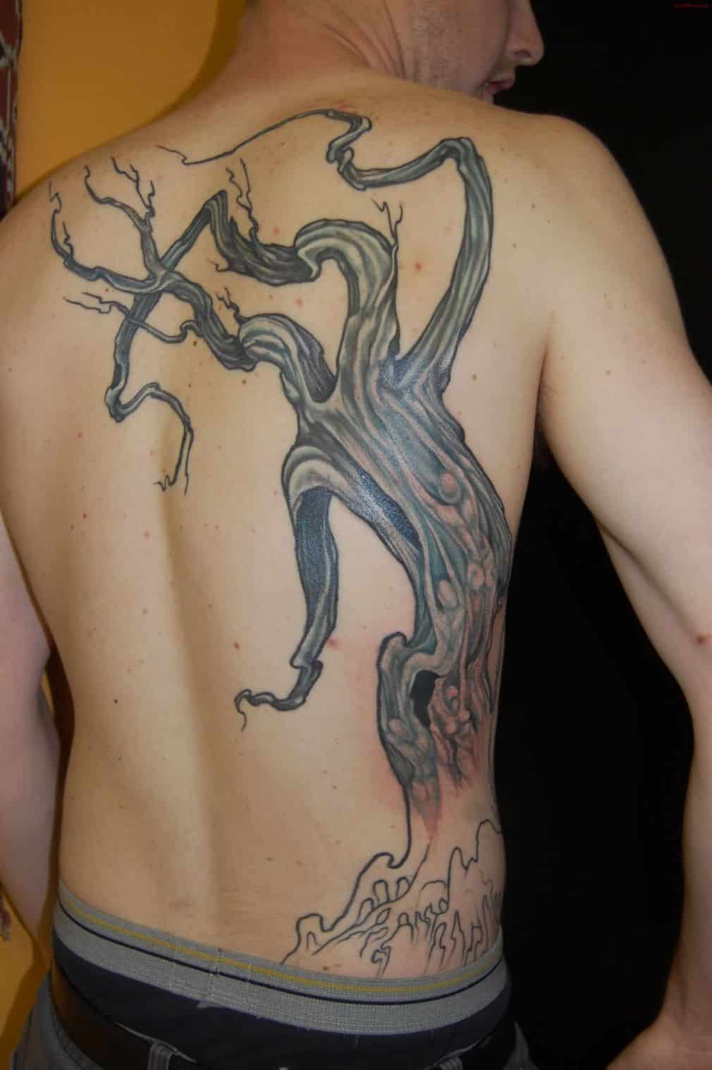 Black Ink Hippie Tree Without Leaves Tattoo On Man Upper Back