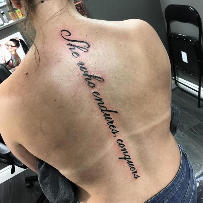 Latin Letters spine tattoo