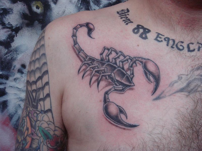 unique scorpio tattoo on man chest