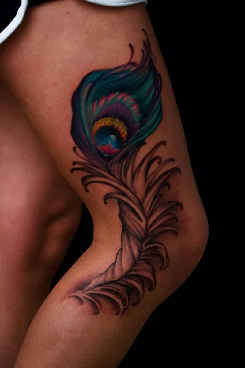 Awesome Color Peacock Feather Tattoo On Side Leg