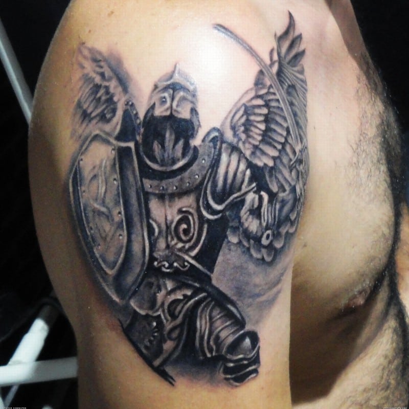 Faceless warrior with wings tattoo